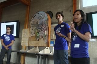 Derrick Tan, German Aguirre and Jessica Lee explaining their sustainable aquaculture - IMTA pinball game.